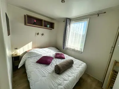 Un ou plusieurs lits dans un hébergement de l'établissement Grand Mobile-Home 6 Places climatisé