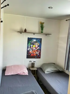 Un ou plusieurs lits dans un hébergement de l'établissement Grand Mobile-Home 6 Places climatisé