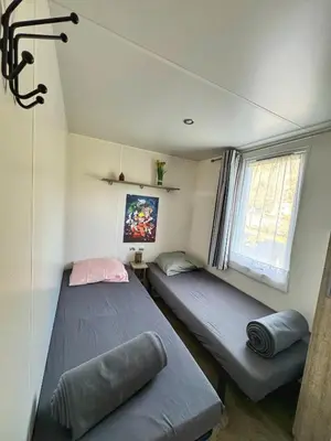 Un ou plusieurs lits dans un hébergement de l'établissement Grand Mobile-Home 6 Places climatisé