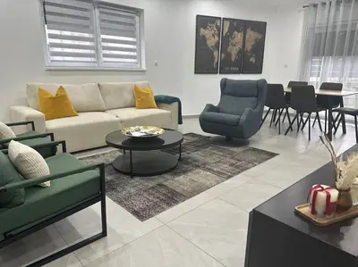 Coin salon dans l'établissement Bel appartement en plain-pied 5 min de Colmar
