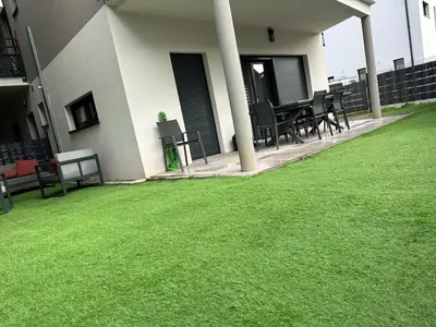 Jardin de l'établissement Bel appartement en plain-pied 5 min de Colmar