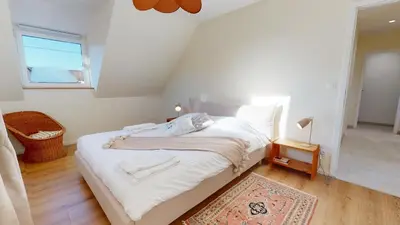 Un ou plusieurs lits dans un hébergement de l'établissement Maison tilleul de la vallée noble