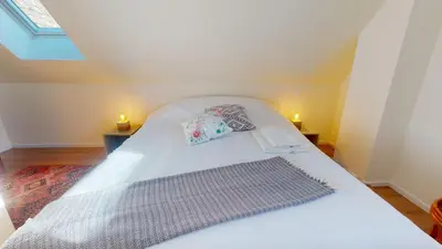 Un ou plusieurs lits dans un hébergement de l'établissement Maison tilleul de la vallée noble