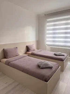 Un ou plusieurs lits dans un hébergement de l'établissement Appartement des 3 pays. 2 mn de Bâle+ Free parking