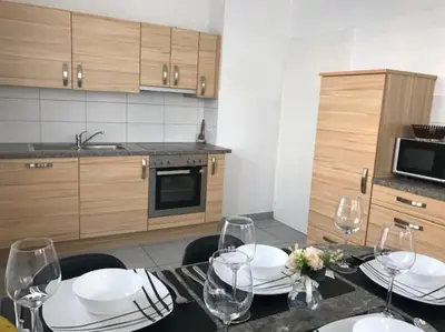 Cuisine ou kitchenette dans l'établissement Appartement des 3 pays. 2 mn de Bâle+ Free parking