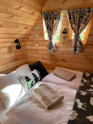 Un ou plusieurs lits dans un hébergement de l'établissement Cabane Insolite Cosy