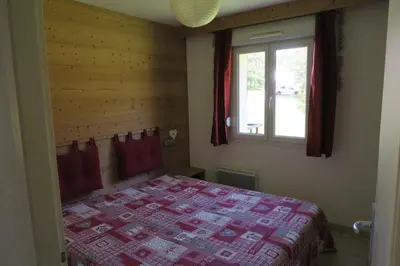 Un ou plusieurs lits dans un hébergement de l'établissement Apartment Location Les balcons de La Mauselaine