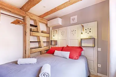 Un ou plusieurs lits dans un hébergement de l'établissement BREDALA**** Gîte maison Alsacienne avec Jardin