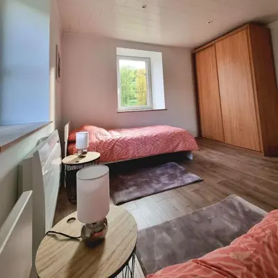 Un ou plusieurs lits dans un hébergement de l'établissement Appartement chaleureux 80m2