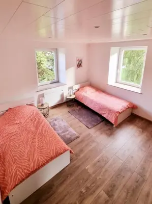 Un ou plusieurs lits dans un hébergement de l'établissement Appartement chaleureux 80m2