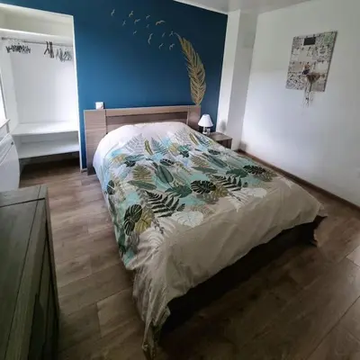 Un ou plusieurs lits dans un hébergement de l'établissement Appartement chaleureux 80m2