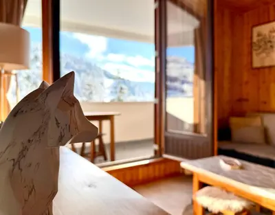Un ou plusieurs lits dans un hébergement de l'établissement Le Cocoøn, balcon, vue station
