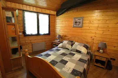 Un ou plusieurs lits dans un hébergement de l'établissement Maison de style chalet individuelle Le Rouge Feigne à La Bresse