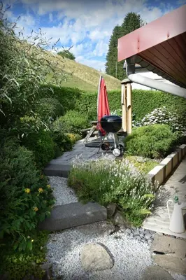 Jardin de l'établissement Maison de style chalet individuelle Le Rouge Feigne à La Bresse