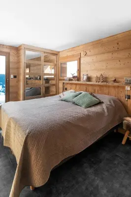 Un ou plusieurs lits dans un hébergement de l'établissement Chalet du Paradis Blanc