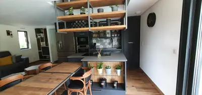 Cuisine ou kitchenette dans l'établissement appartement standing Gérardmer jacuzzi