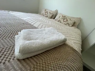 Un ou plusieurs lits dans un hébergement de l'établissement Colmar Appartement terrasse 10min centre ville