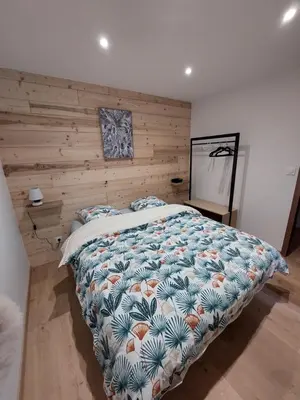 Un ou plusieurs lits dans un hébergement de l'établissement Bel appartement 6pers