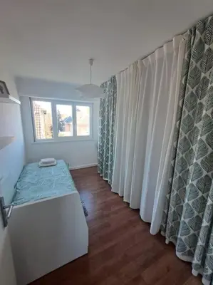 Un ou plusieurs lits dans un hébergement de l'établissement Appartement proche centre-ville, parking gratuit