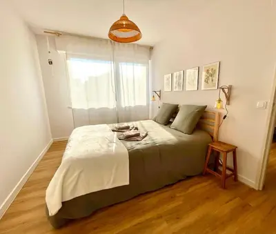 Un ou plusieurs lits dans un hébergement de l'établissement Maison individuelle 100 m2, jardin et parking privé