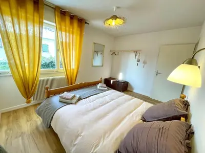 Un ou plusieurs lits dans un hébergement de l'établissement Maison individuelle 100 m2, jardin et parking privé