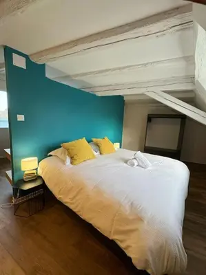Un ou plusieurs lits dans un hébergement de l'établissement Les pensées d'Anne & Marie duplex 4/6 Personnes
