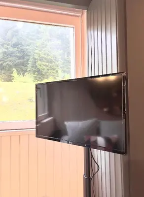 Télévision ou salle de divertissement dans l'établissement Ma Montagne Chic 4