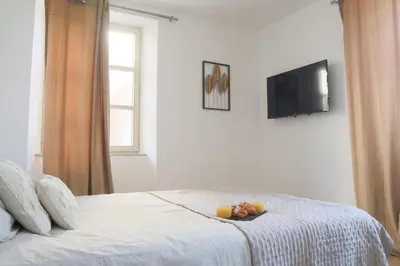 Un ou plusieurs lits dans un hébergement de l'établissement La Chambre Aux Anges