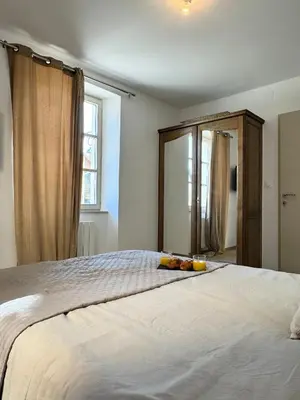 Un ou plusieurs lits dans un hébergement de l'établissement La Chambre Aux Anges