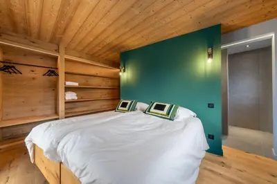 Un ou plusieurs lits dans un hébergement de l'établissement L'Alcôve - Chalet avec Piscine