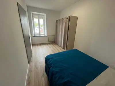 Un ou plusieurs lits dans un hébergement de l'établissement Appartement centre-ville de Lure droit