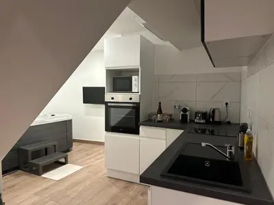 Cuisine ou kitchenette dans l'établissement Appartement Douceur