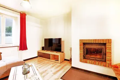 Télévision ou salle de divertissement dans l'établissement Le Chtit Appart - Joli appt vue montagne