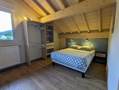 Un ou plusieurs lits dans un hébergement de l'établissement Maison Gite Le Skieur