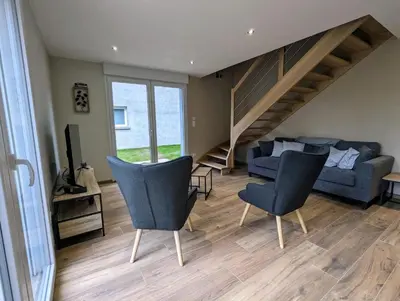 Coin salon dans l'établissement Maison Gite Le Skieur