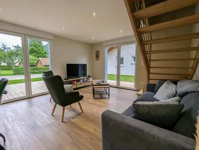 Coin salon dans l'établissement Maison Gite Le Skieur