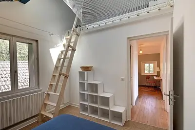 Un ou plusieurs lits dans un hébergement de l'établissement Le Chemin des Cerisiers - Maison vue montagne