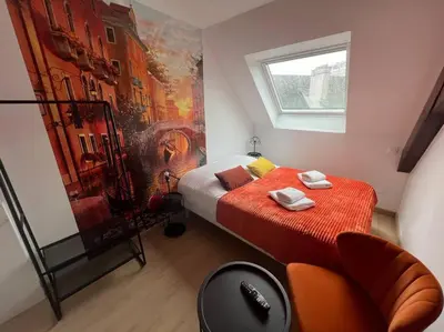 Un ou plusieurs lits dans un hébergement de l'établissement Esprit Italie, joli studio au coeur de Mulhouse