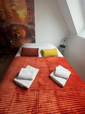 Un ou plusieurs lits dans un hébergement de l'établissement Esprit Italie, joli studio au coeur de Mulhouse