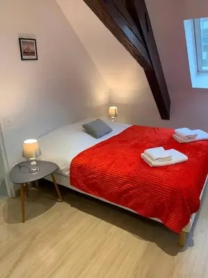 Un ou plusieurs lits dans un hébergement de l'établissement Esprit Espagne, joli studio au coeur de Mulhouse