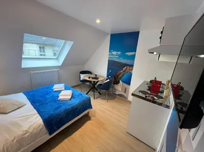 Un ou plusieurs lits dans un hébergement de l'établissement Esprit Grèce, joli studio au coeur de Mulhouse