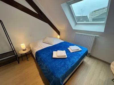 Un ou plusieurs lits dans un hébergement de l'établissement Esprit Grèce, joli studio au coeur de Mulhouse