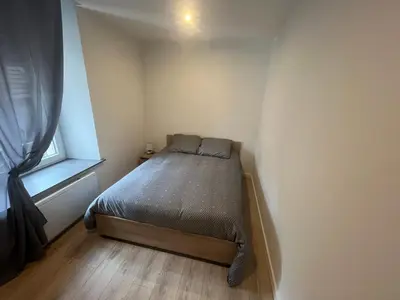 Un ou plusieurs lits dans un hébergement de l'établissement Appartement 2 chambres centre-ville