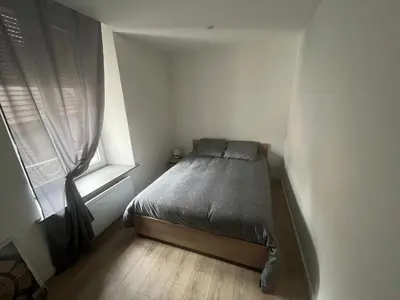 Un ou plusieurs lits dans un hébergement de l'établissement Appartement 2 chambres centre-ville
