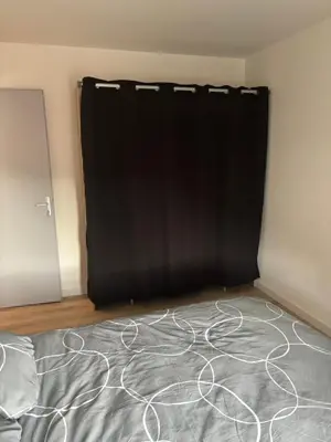 Un ou plusieurs lits dans un hébergement de l'établissement Appartement 2 chambres centre-ville