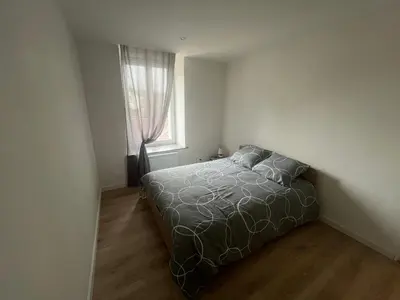 Un ou plusieurs lits dans un hébergement de l'établissement Appartement 2 chambres centre-ville