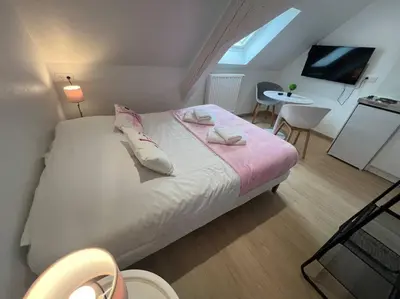 Un ou plusieurs lits dans un hébergement de l'établissement Esprit France, joli studio au coeur de Mulhouse
