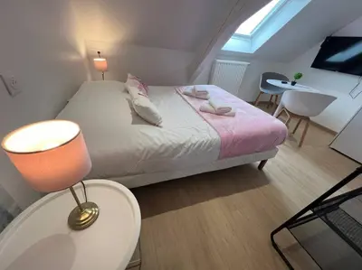 Un ou plusieurs lits dans un hébergement de l'établissement Esprit France, joli studio au coeur de Mulhouse