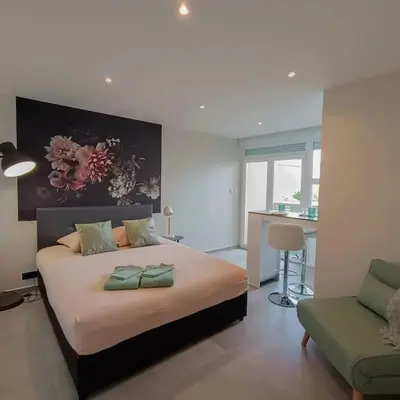 Un ou plusieurs lits dans un hébergement de l'établissement Appartement proche du centre
