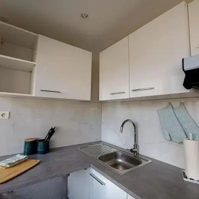 Cuisine ou kitchenette dans l'établissement Appartement proche du centre